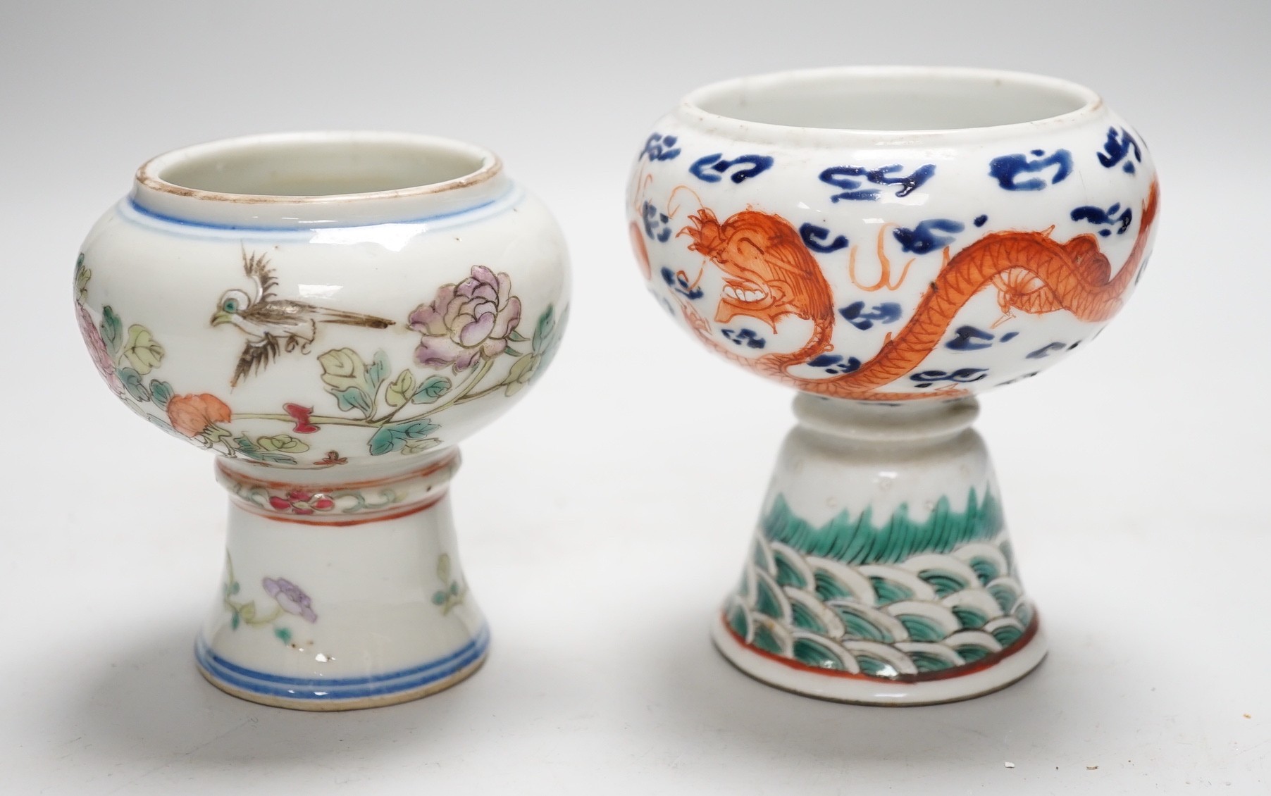 Two 19th century Chinese enamelled porcelain stem bowls, The first painted with Dragons chasing a flaming pearl, 10cm, the second painted with a bird amid flowers